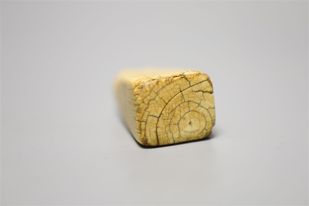 A Chinese Ming ivory seal, height 5cm, carved with a lion-dog